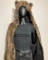 Mannequin wearing a black t-shirt and fur-lined coat with animal ears on a plain background