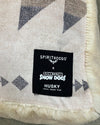 Label on a patterned fabric with 'Spirithoods' branding