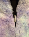 Close-up of a fluffy, multicolored fabric with a zipper running through it.