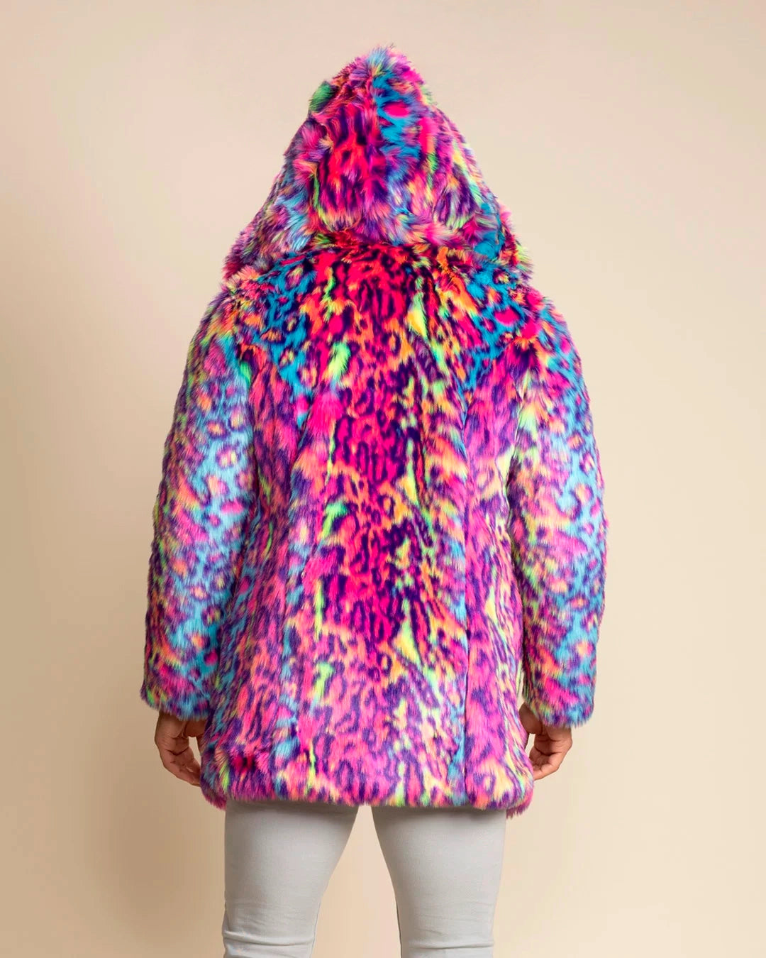 A Man Wearing SpiritHoods Made to Order Neon Blue & Pink Faux Fur Coat in Colorfu Leopard Print facing away from the camera, with the hood up showing a range of neon colors and leopard spotted print. SpiritHoods Fall Winter Custom Faux Fur Coat and Jacket Collection