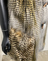 Mannequin wearing a textured hawk inspired faux fur vest with a plain background