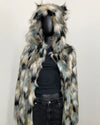 Multicolored faux fur coat with hood on a mannequin against a white background