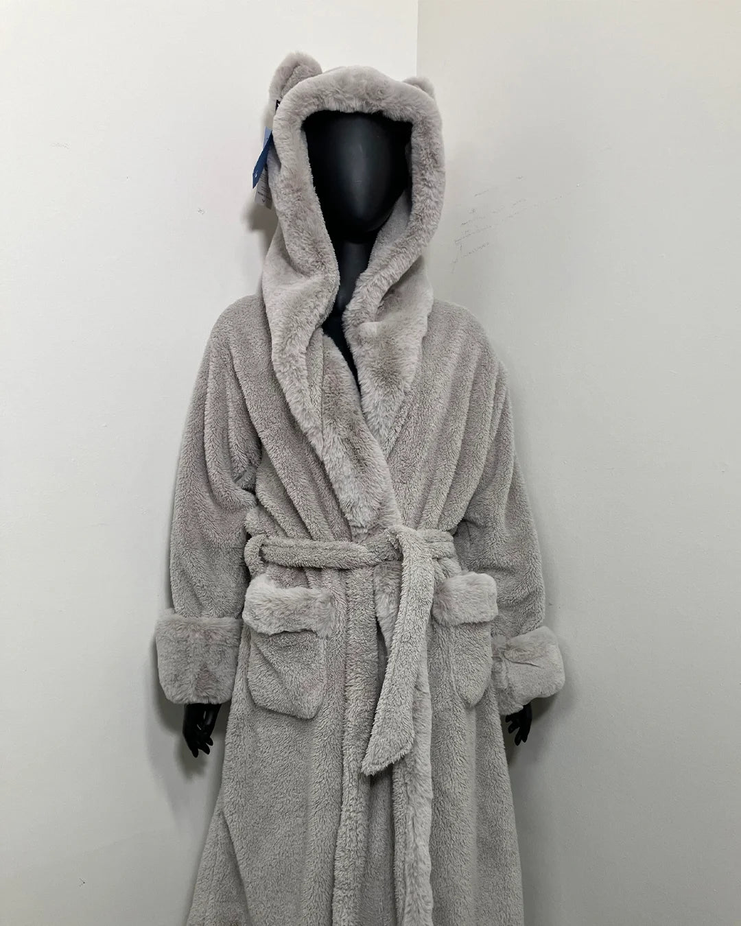 black mannequin wearing a silver grey fox bathrobe with plush double sided fabric and plush fake fur trim