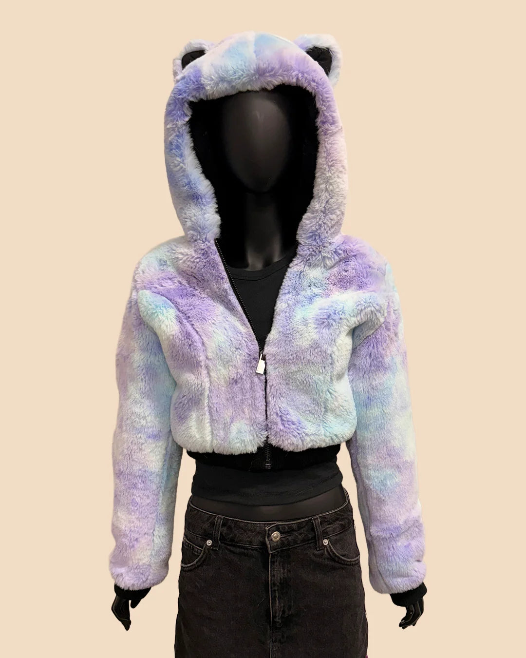 Multicolored blue and purple tiedye faux fur cropped jacket with cat ears on a beige background