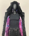Mannequin wearing a black Faux Fur Coat-lined coat with pink and purple galaxy print against a beige background