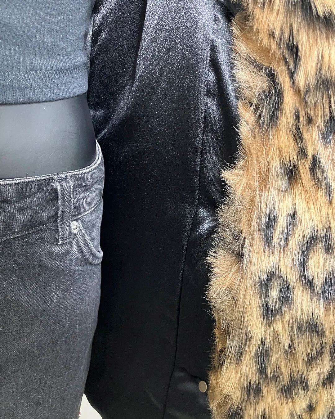 close-up photo of the poly-satin black lining and leopard faux fur. SpiritHoods Online Sample Sale Faux Fur Coat in Leopard Print in Size MEDIUM.
