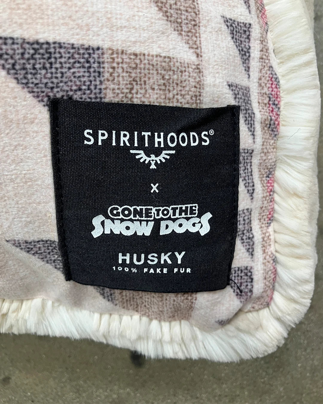 Label on a product with 'Spirithoods' and 'Gone to the Snow Dogs' branding.