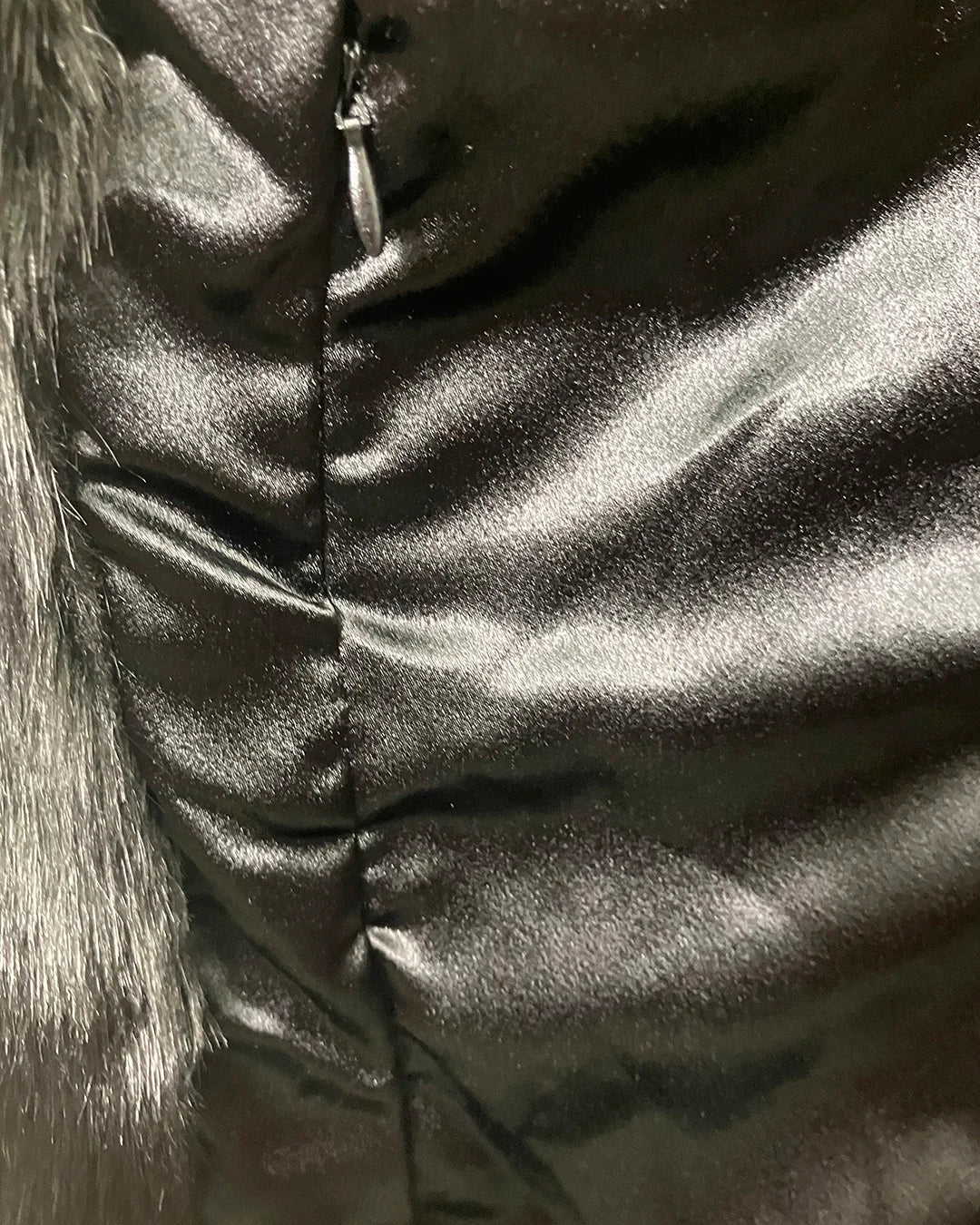 Close-up of a shiny, poly-satin fabric showing the inner secret zipper pocket placement. | SpiritHoods Online Sample Sale Style Black Panther in Size SMALL