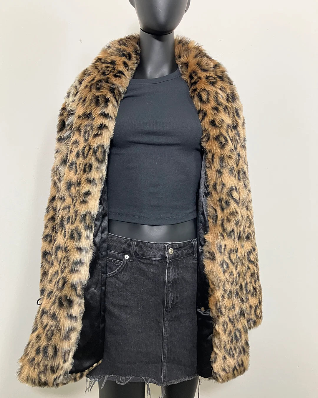 Leopard print faux fur coat on a mannequin against a white background showing the relaxed fit with the collar down. SpiritHoods Online Sample Sale Faux Fur Coat in Leopard Print in Size MEDIUM.