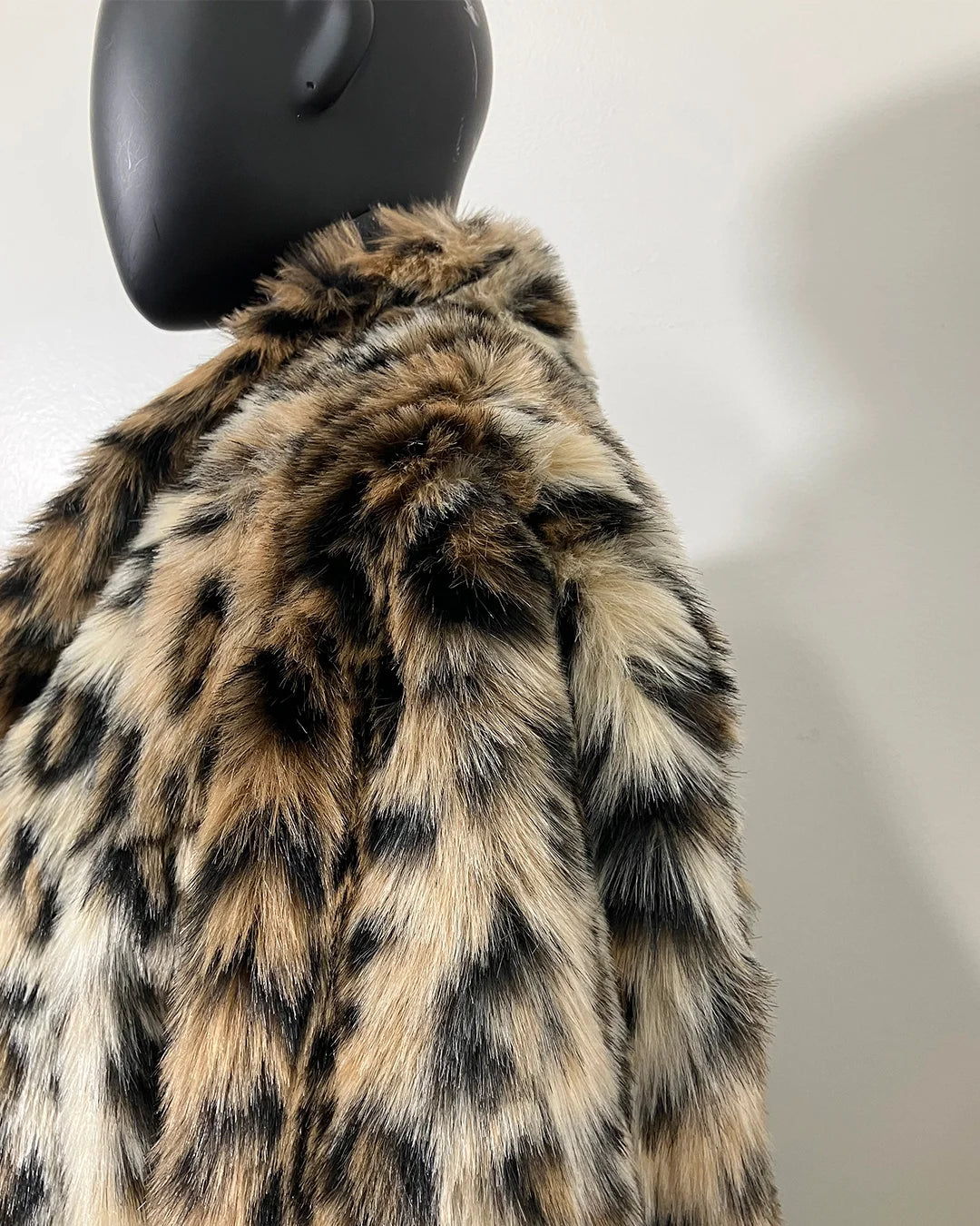 close-up photo of the short pile leopard print faux fur coat and collar