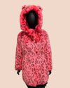 Pink leopard print fake fur coat with a hood on a beige background