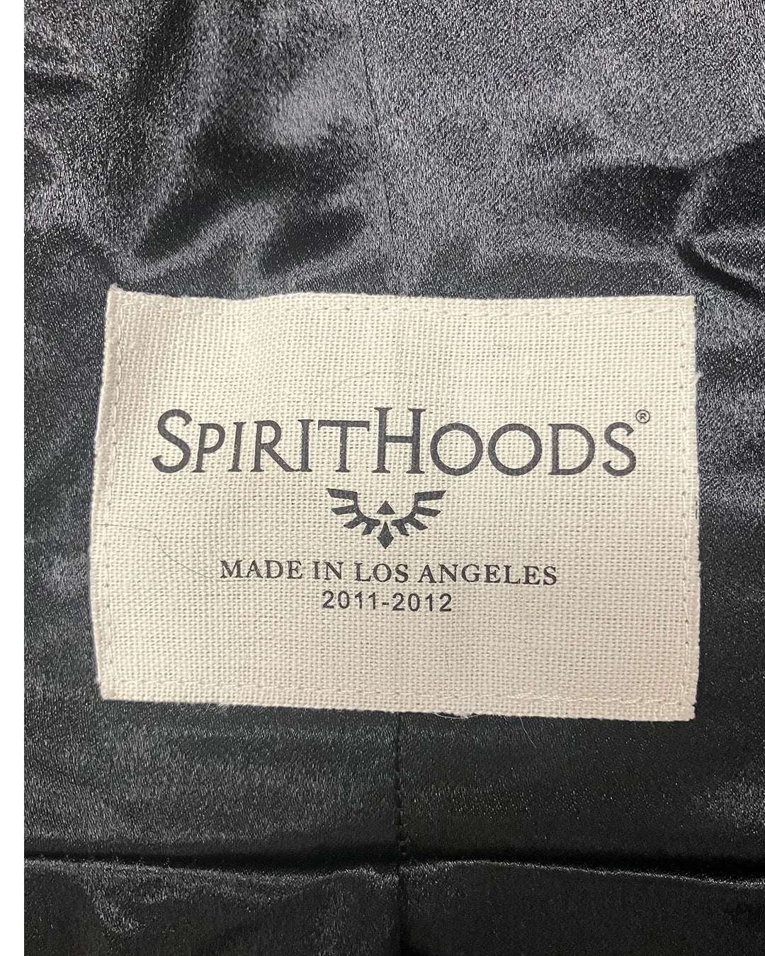 Label with 'SpiritHoods - Made In Los Angeles' necklabel on a dark black poly-satin fabric | SpiritHoods Online Sample Sale Style Black Panther in Size SMALL