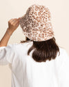 Person wearing a leopard print bucket hat against a plain background