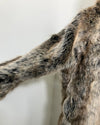 Close-up of a fake fur coat with a neutral background