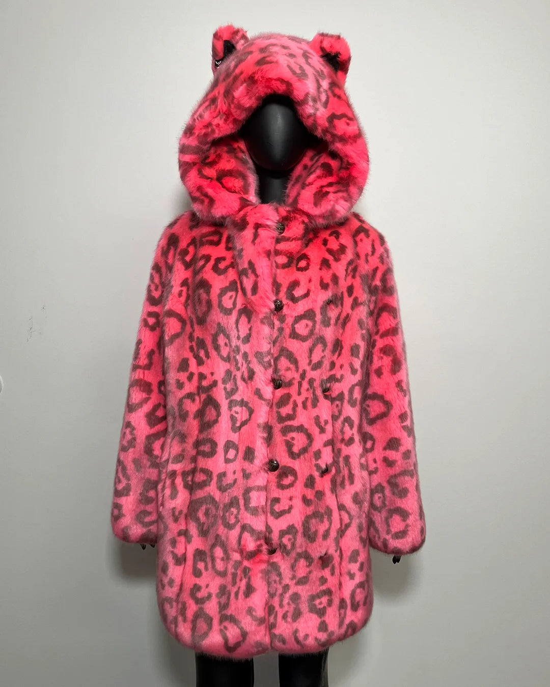 Pink leopard print coat with feline ears on a white background