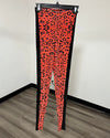 Orange and black Cheetah print leggings with black side panels running down the sides.