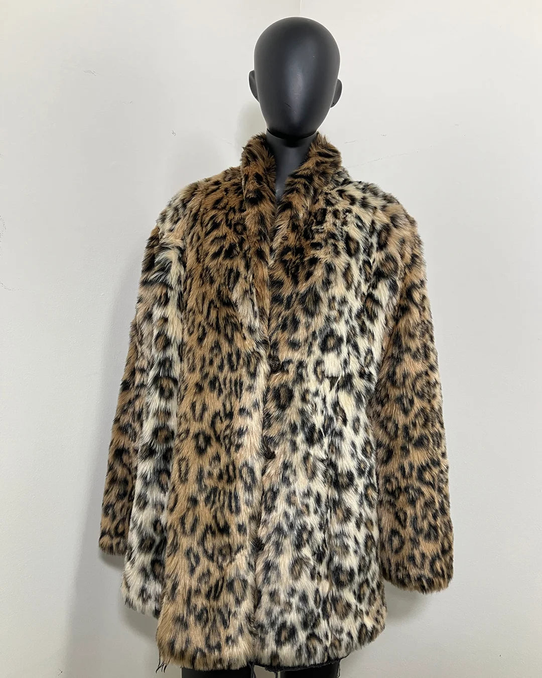 Leopard print fake fur jacket button up on a mannequin against a white background. SpiritHoods Online Sample Sale Faux Fur Coat in Leopard Print in Size MEDIUM.