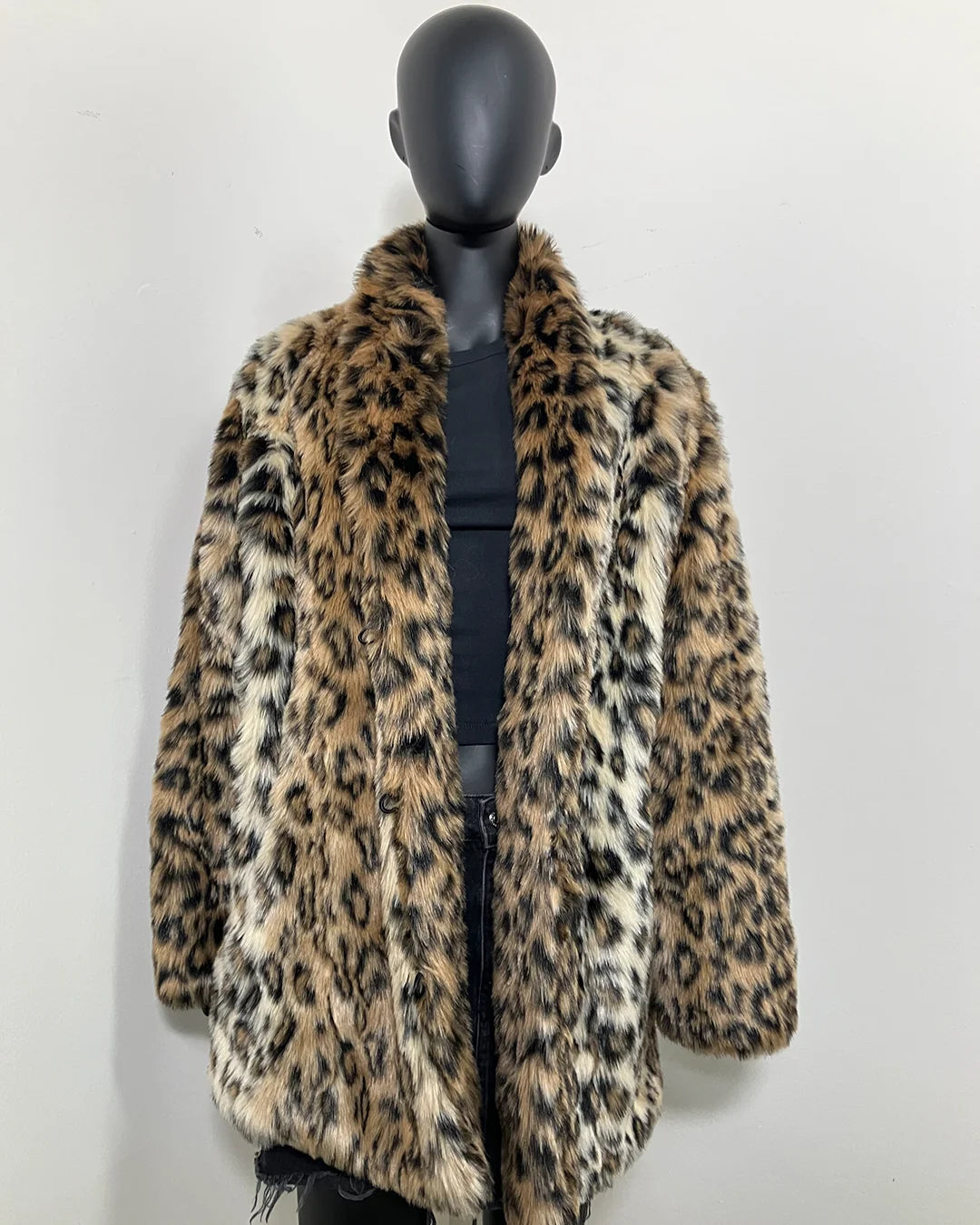 Leopard print faux fur coat on a mannequin against a white background showing the relaxed fit with the collar down. SpiritHoods Online Sample Sale Faux Fur Coat in Leopard Print in Size MEDIUM.