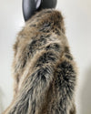 Fake Fur coat on a mannequin against a plain background