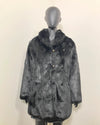 Mannequin wearing a all black fake fur coat on a plain background, show casing the peacoat button closure and leopard face buttons. SpiritHoods Online Sample Sale Style: Collared Faux Fur Coat in Black Panther - Size MEDIUM.