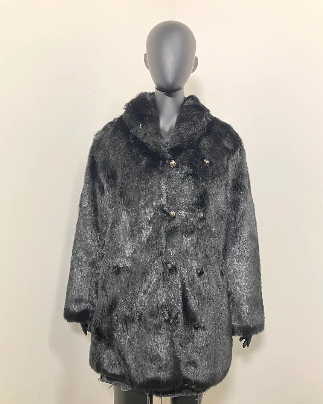 Mannequin wearing a all black fake fur coat on a plain background, show casing the peacoat button closure and leopard face buttons. SpiritHoods Online Sample Sale Style: Collared Faux Fur Coat in Black Panther - Size MEDIUM.