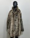 Grey Faux Fur coat on a mannequin against a white background