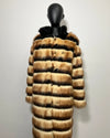 Faux Fur coat on a mannequin against a white background