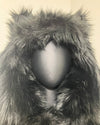 Close-up of a fluffy, black-colored hood with wolf ears, slightly choppy fake fur cut at wearers front center of hood. SpiritHoods XXS Sizing Black Wolf Online Sample Sale Style