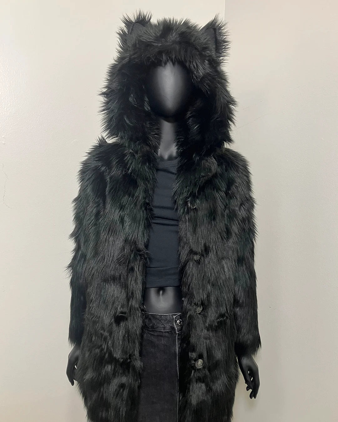 Mannequin wearing a black faux fur coat with a hood on a plain background. SpiritHoods XXS Sizing Black Wolf Online Sample Sale Style