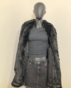 mannequin wearing SpiritHoods Black Panther Faux Fur Coat with Collar - showing the all black lining with snakeskin inspired print + inner welt pocket, and inner zipper pocket. 
