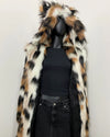 Mannequin wearing a faux fur coat with a black top and jeans on a white background