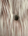 Close-up of spirithoods branded button on the one of a kind classic faux fur galah wolf coat