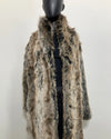 fake fur grey wolf jacket on a mannequin against a white background