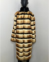 Fake Fur coat on a mannequin against a plain background