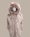 Pink faux fur coat with hood on a mannequin against a beige background
