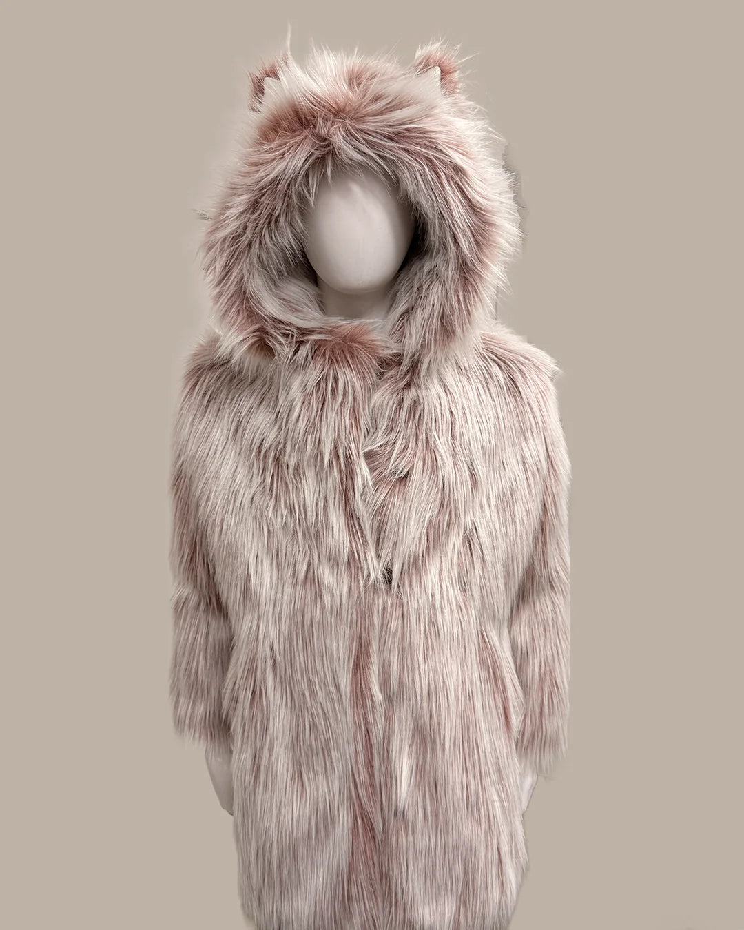 Pink faux fur coat with hood on a mannequin against a beige background