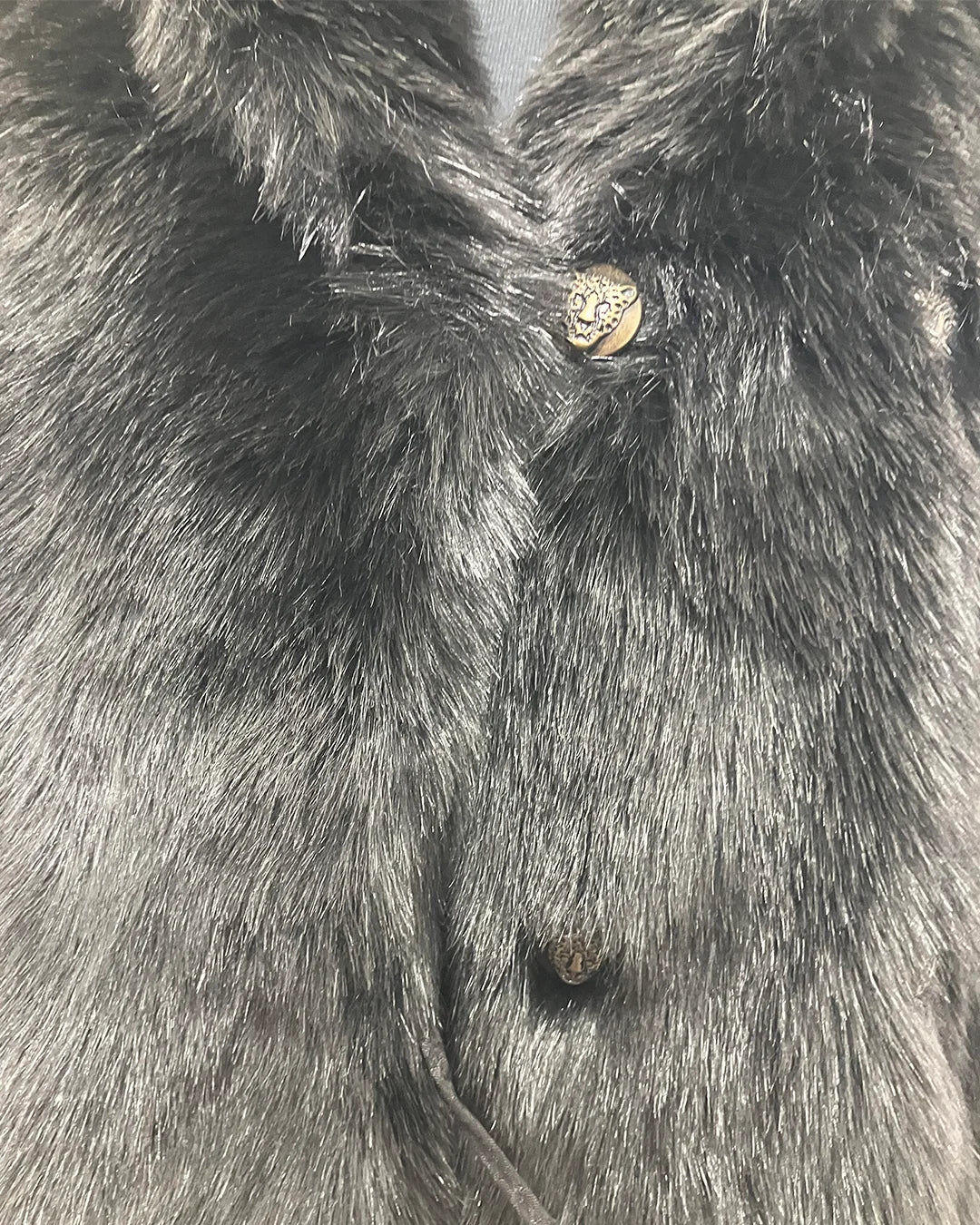 Close-up photo of the broken button loop on the 2nd row. & The Leopard Face Buttons. SpiritHoods Online Sample Sale style Black Panther Faux Fur Coat in MEDIUM