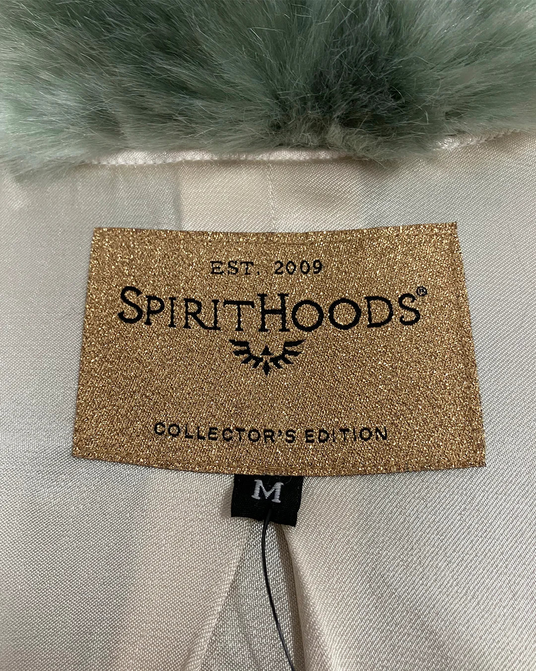 Spirithoods Collector Edition neck label on the hummingbird faux fur coat