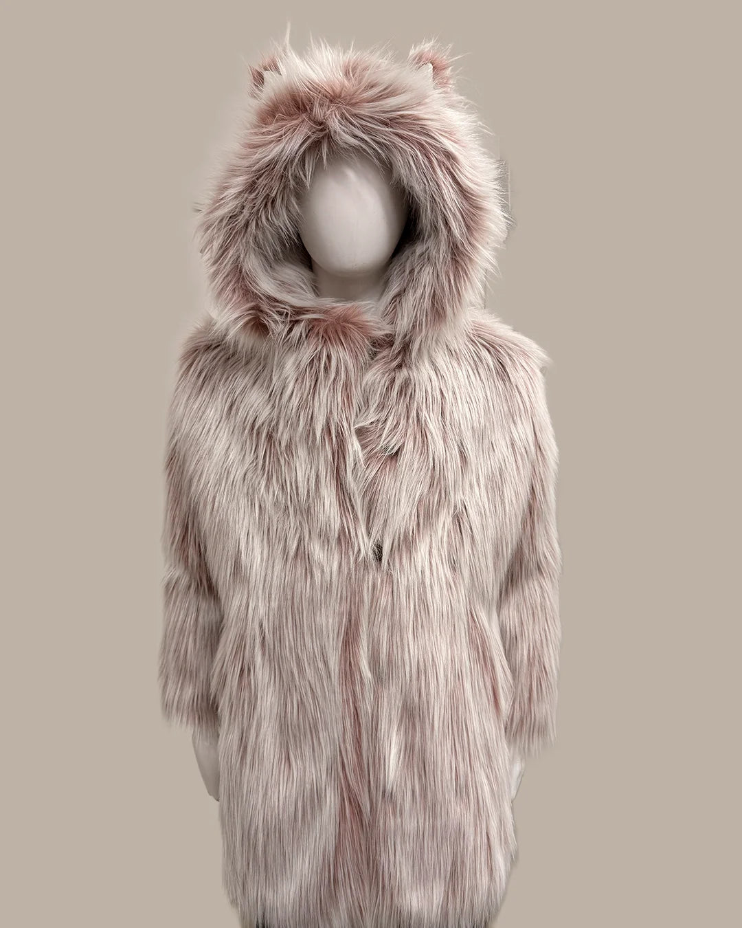 Pink faux fur coat with hood on a mannequin against a beige background