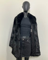 Mannequin wearing a black collared faux fur coat with black lining and inner welt pocket showing. SpiritHoods Online Sample Sale style Black Panther Faux Fur Coat in MEDIUM