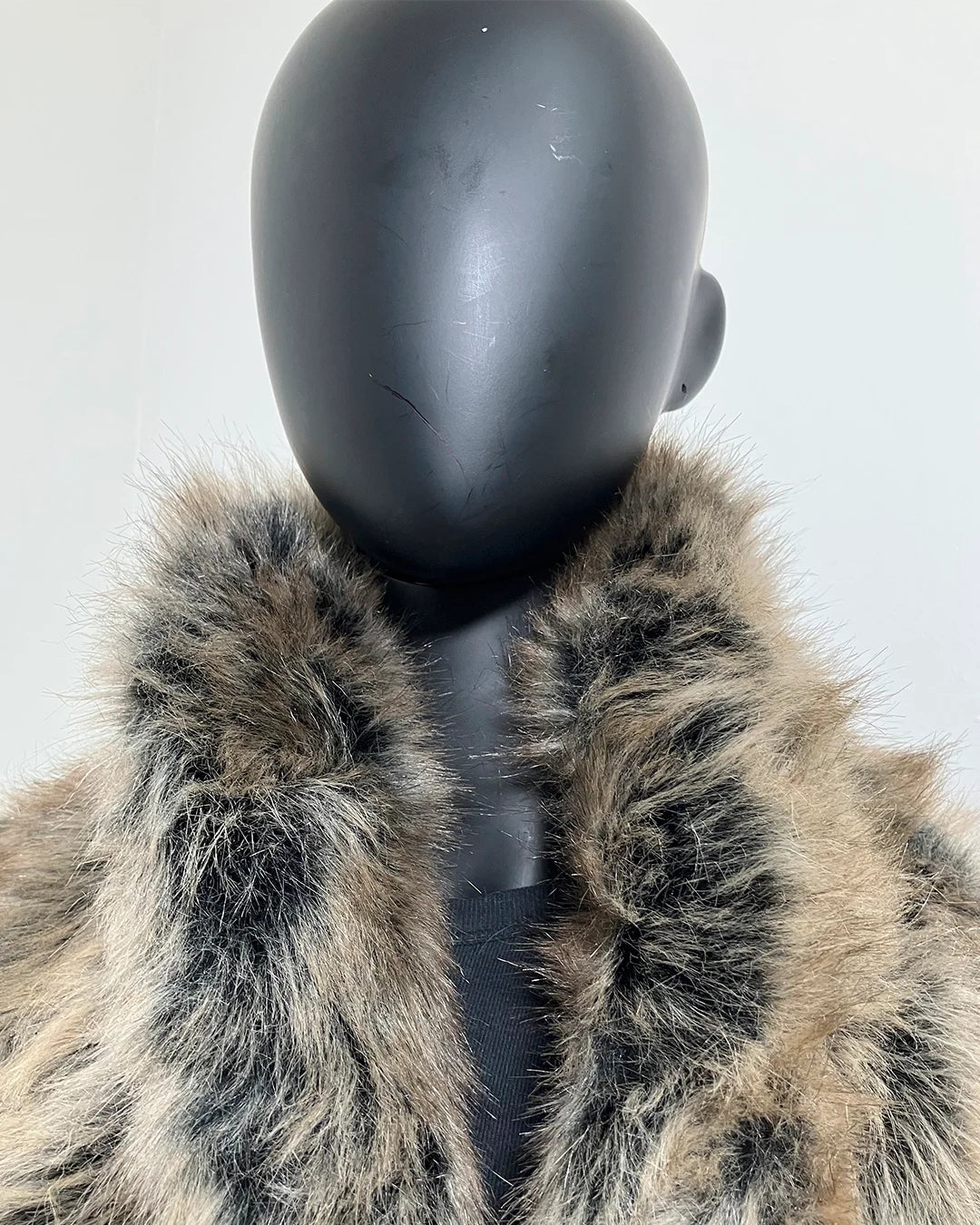 Grey Wolf Fake Fur Collar on a mannequin with a plain background