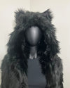 Mannequin wearing a black plush faux fur coat with an oversized hood with wolfears, against a plain background. SpiritHoods XXS Sizing Black Wolf Online Sample Sale Style