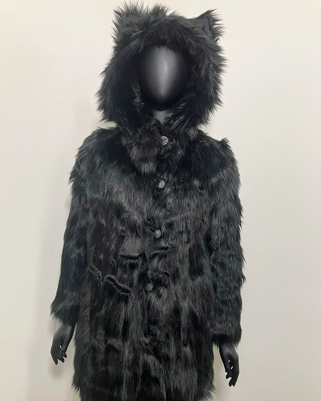 Black fake fur coat with hood on a mannequin against a plain background. SpiritHoods XXS Sizing Black Wolf Online Sample Sale Style