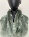 Green fake fur collared jacket on a mannequin against a white background