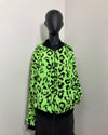 black mannequin wearing spirithoods colorful faux fur bomber jacket with a zipper and neon green leopard print short pile fake fur.