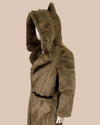 plush deep green fake fur coat with a hood on a beige background