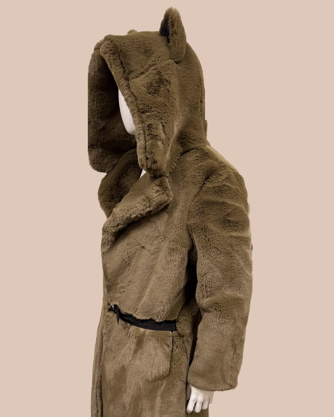 plush deep green fake fur coat with a hood on a beige background