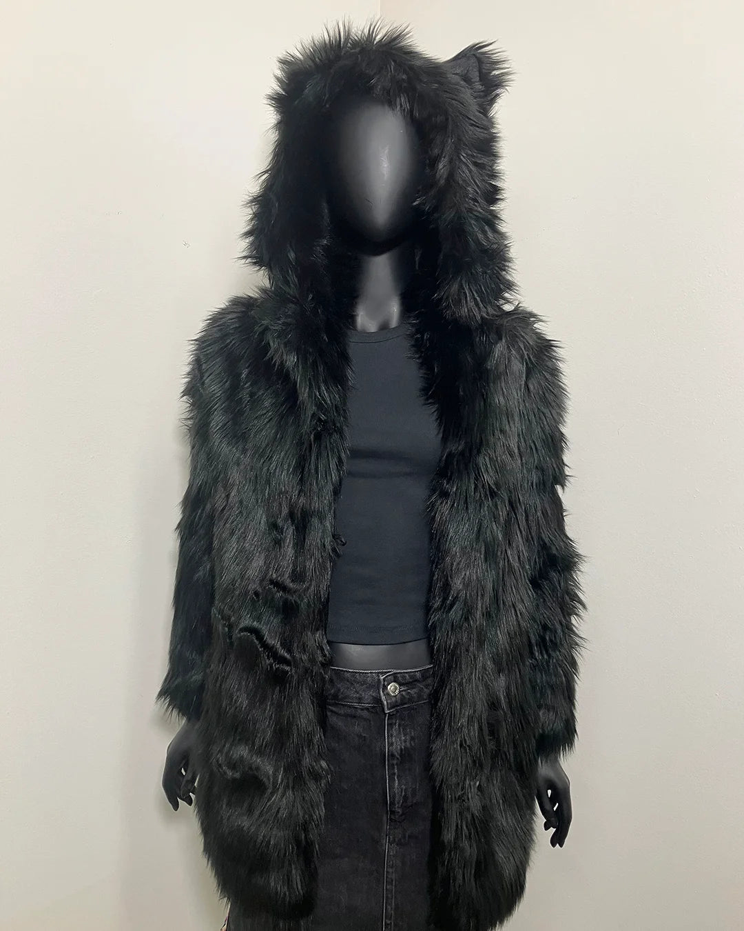 Black furry hooded fake fur jacket on a mannequin against a plain background. SpiritHoods XXS Sizing Black Wolf Online Sample Sale Style