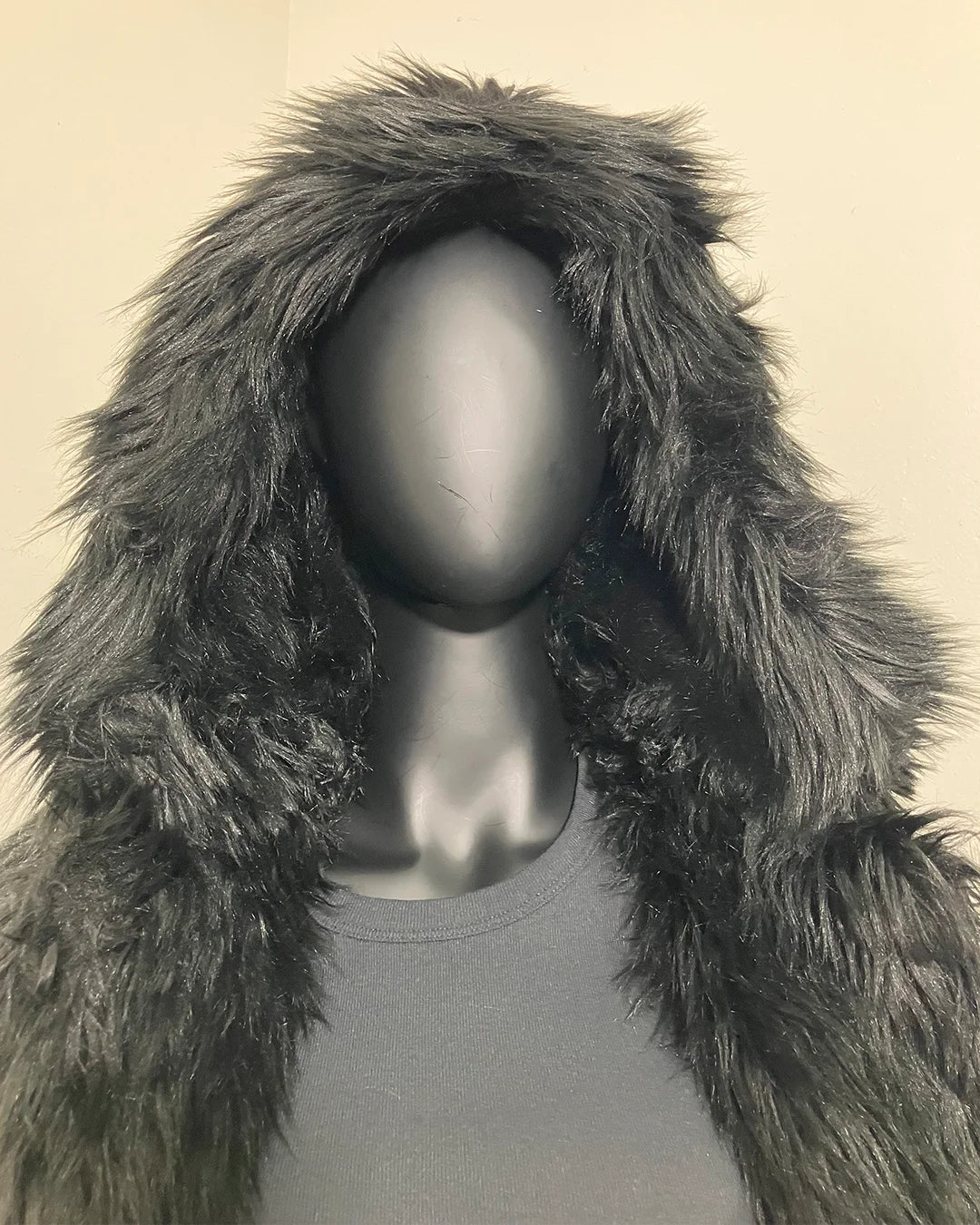 mannequin wearing the Black Wolf Hooded Fake Fur Jacket by SpiritHoods - close up photo of the plush long-pile faux fur in black