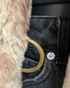 Close-up of a gold d-ring closure on the cougar fauxfur long coat